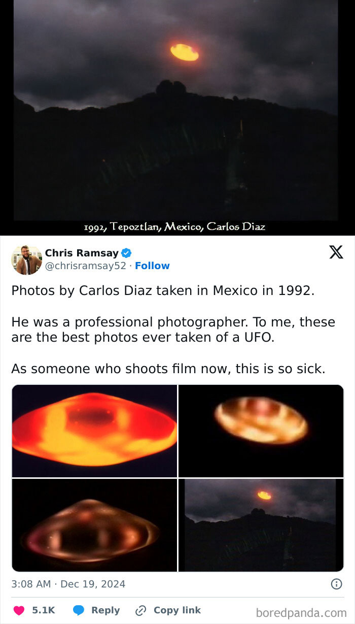 Glowing orange unidentified object hovering above dark mountainous landscape under cloudy night sky.