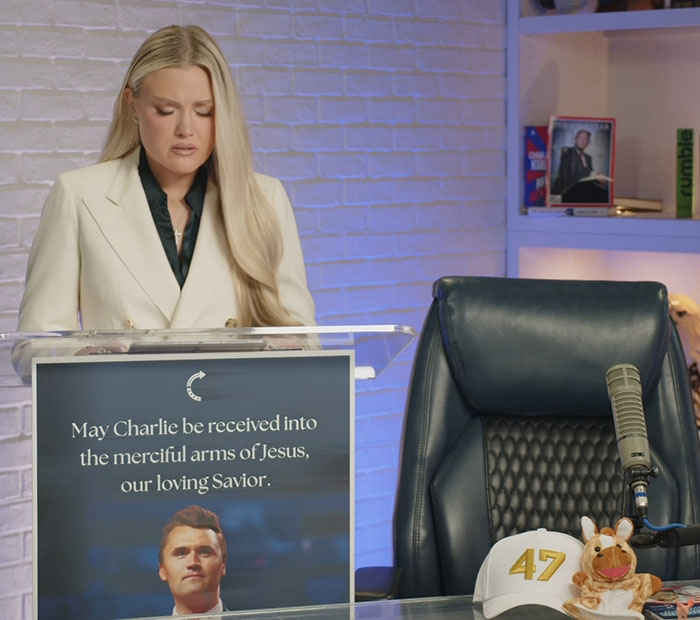 Woman in a white blazer at a podium with a memorial sign, related to FBI DNA evidence linking Tyler Robinson case. Woman in a white blazer at a podium with a memorial sign, related to FBI DNA evidence linking Tyler Robinson case.