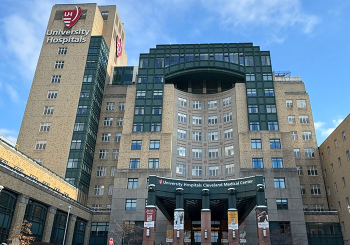 University Hospitals Cleveland Medical Center building under blue sky, related to cop opens fire and self-defense debate. University Hospitals Cleveland Medical Center building under blue sky, related to cop opens fire and self-defense debate.