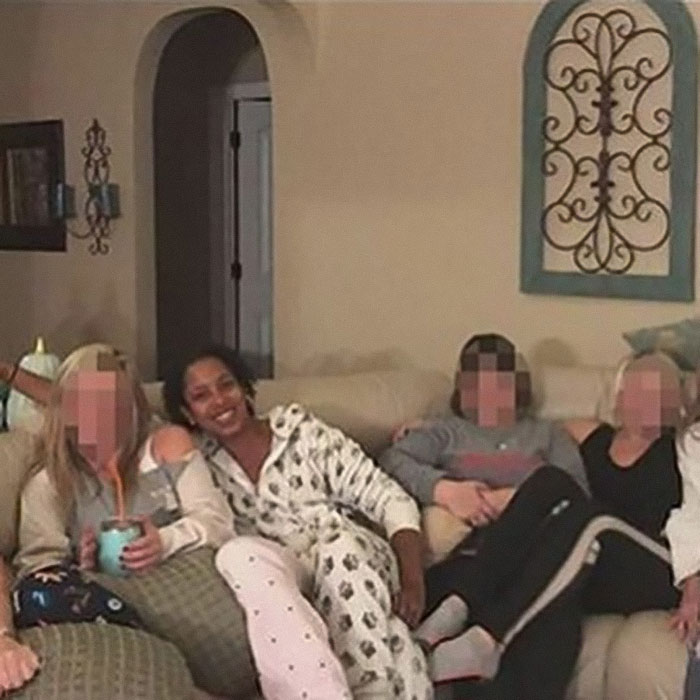 Group of people on a couch in a home, related to Brooklyn midwife’s dice game club safety concerns for non-white women.