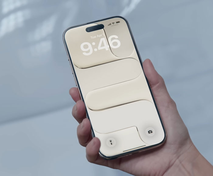 Hand holding new iPhone with light beige abstract wallpaper, related to Samsung mocking new iPhone launch and brand competition. Hand holding new iPhone with light beige abstract wallpaper, related to Samsung mocking new iPhone launch and brand competition.