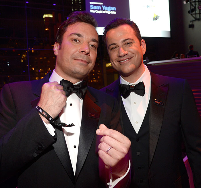 Jimmy Fallon and Jimmy Kimmel smiling in tuxedos at an event, relating to show suspension and TV host discussions. Jimmy Fallon and Jimmy Kimmel smiling in tuxedos at an event, relating to show suspension and TV host discussions.