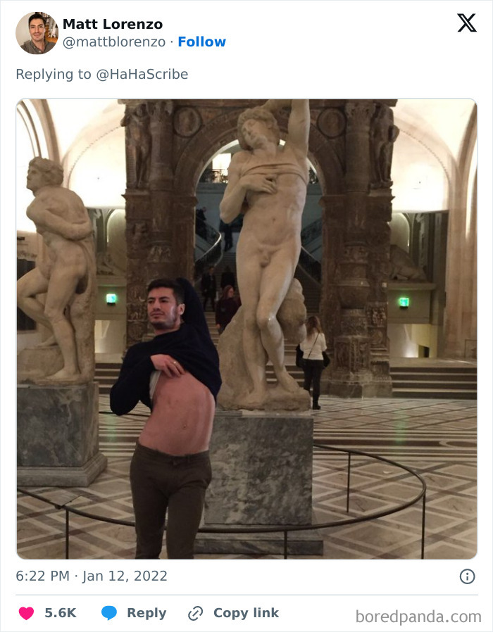 Man in museum creatively imitating iconic art statue pose by lifting his shirt in front of classical sculptures. Man in museum creatively imitating iconic art statue pose by lifting his shirt in front of classical sculptures.