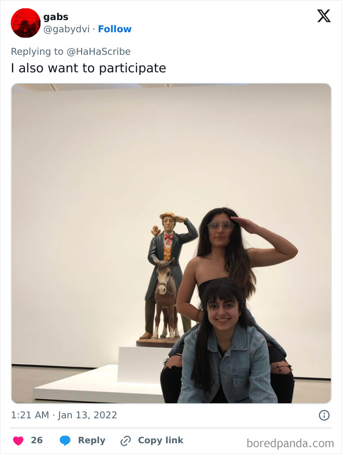 Two women creatively imitating iconic art pose with a statue in a minimalist gallery setting for hilarious effect. Two women creatively imitating iconic art pose with a statue in a minimalist gallery setting for hilarious effect.