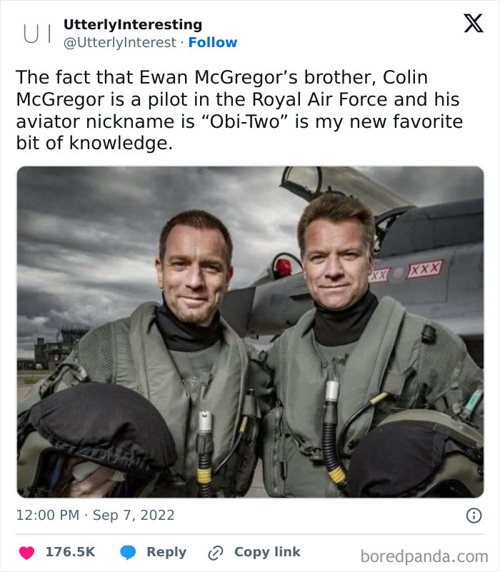 Two pilots in flight suits in front of a military aircraft, sharing a fun fact about aviator nicknames in super culture.