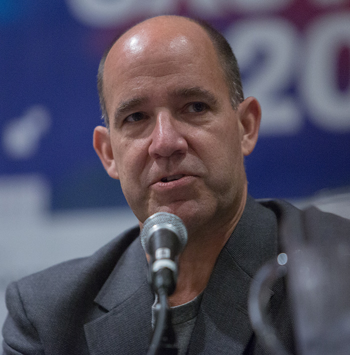 Commentator speaking into microphone during event, linked to unacceptable Charlie Kirk remarks after Utah tragedy firing. Commentator speaking into microphone during event, linked to unacceptable Charlie Kirk remarks after Utah tragedy firing.