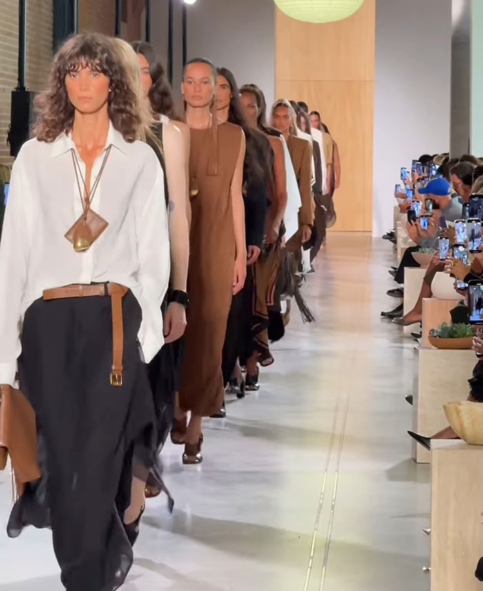 Models walking the runway showcasing sheer outfits and toned abs at New York Fashion Week event. Models walking the runway showcasing sheer outfits and toned abs at New York Fashion Week event.