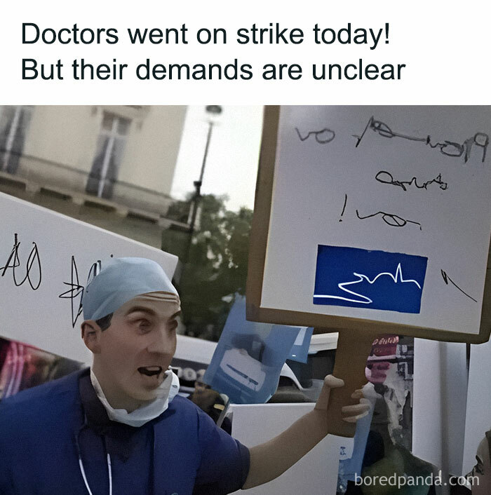 Paramedic holding a sign with unclear text during a strike, highlighting humor relatable to EMT and paramedic professionals.