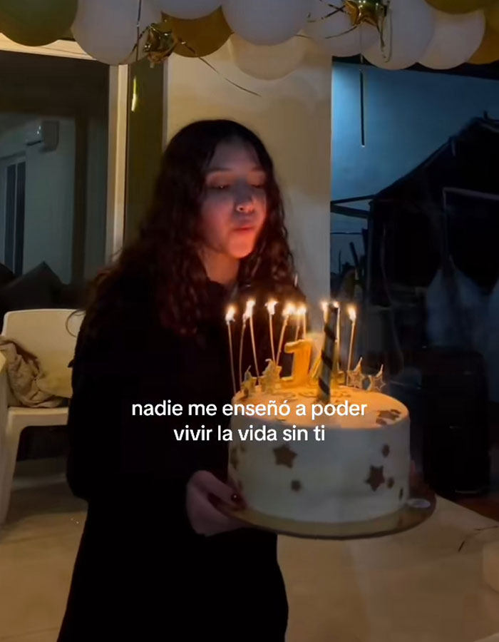 Teen girl holding birthday cake with candles, related to surgeon who performed fatal breast enlargement detention case. Teen girl holding birthday cake with candles, related to surgeon who performed fatal breast enlargement detention case.