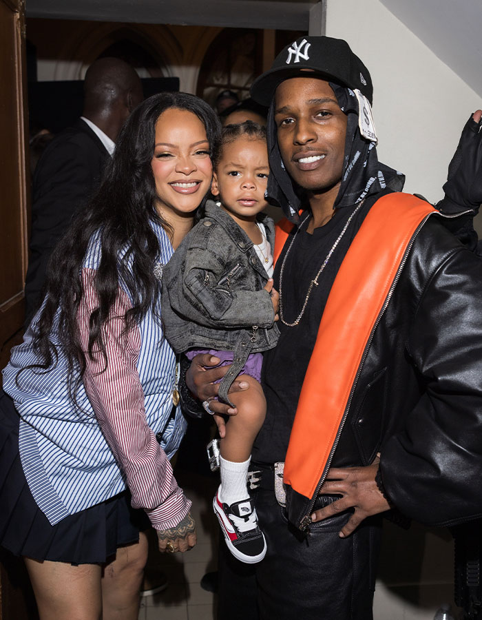 Rihanna smiling with a man and child, Rihanna fans urge her to change cruel name given to newborn daughter. Rihanna smiling with a man and child, Rihanna fans urge her to change cruel name given to newborn daughter.
