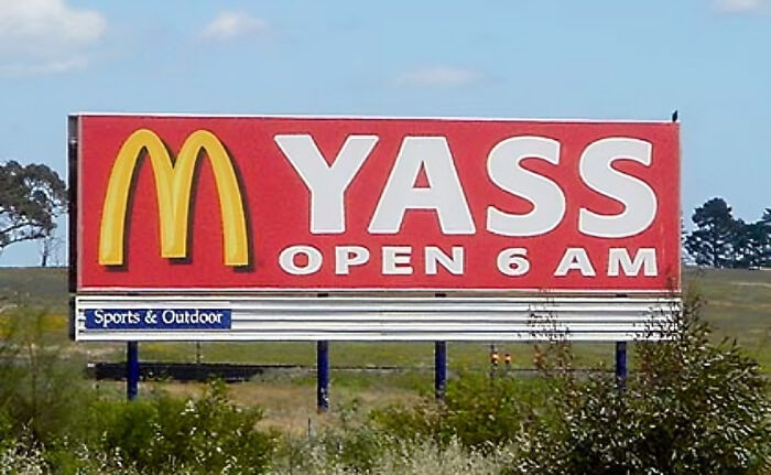 Billboard with altered McDonald's logo spelling a misleading word, an example of companies that failed miserably on social media.