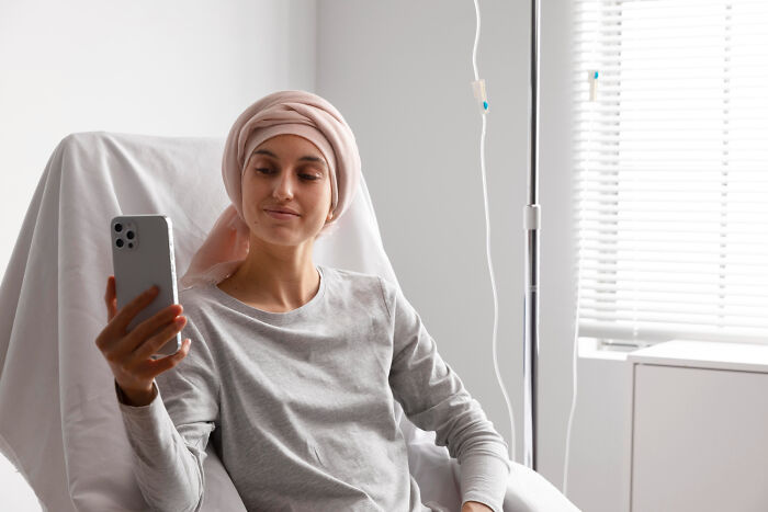 Young woman taking a selfie in hospital, reflecting on the moment she realized she had fallen out of love.