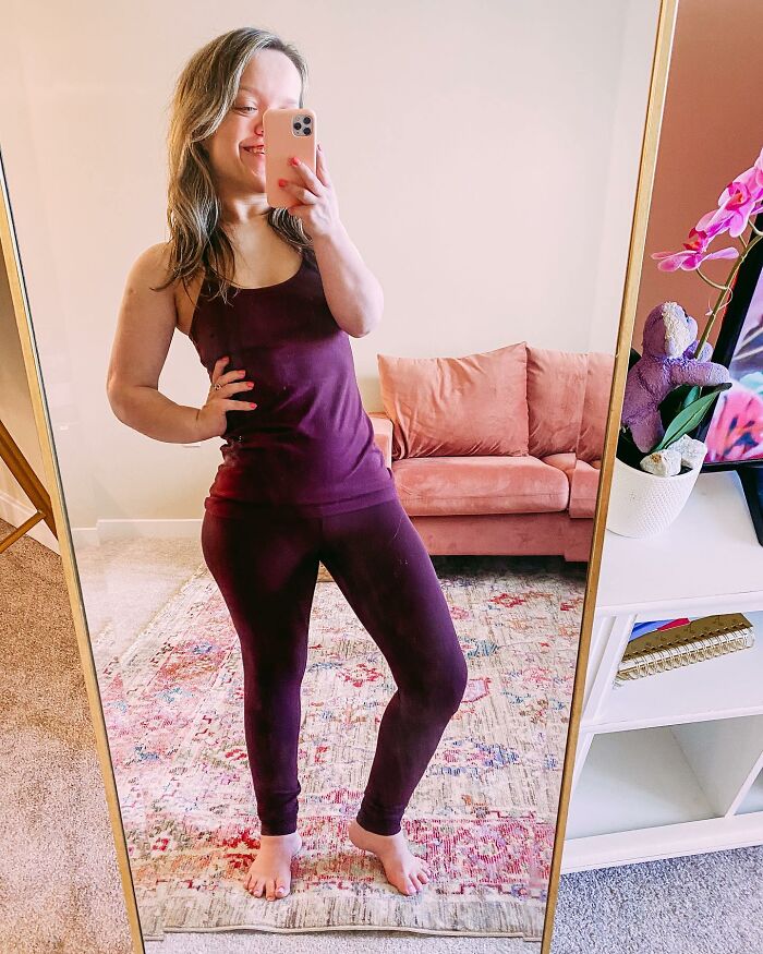 31YO woman with dwarfism wearing purple outfit taking a mirror selfie showing her height surgery transformation. 31YO woman with dwarfism wearing purple outfit taking a mirror selfie showing her height surgery transformation.