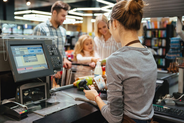 Checkout clerk scanning groceries for family, capturing a mind-boggling conversation that makes one wonder survival skills.