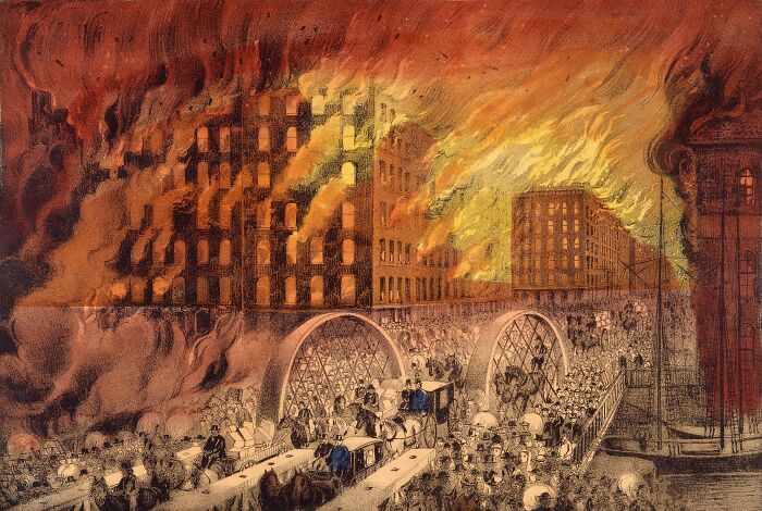 Historic buildings engulfed in flames with crowds evacuating, illustrating common false assumptions about history.