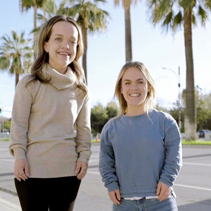 31YO woman with dwarfism smiling outdoors with friend, showcasing transformation after height surgery as a teen. 31YO woman with dwarfism smiling outdoors with friend, showcasing transformation after height surgery as a teen.