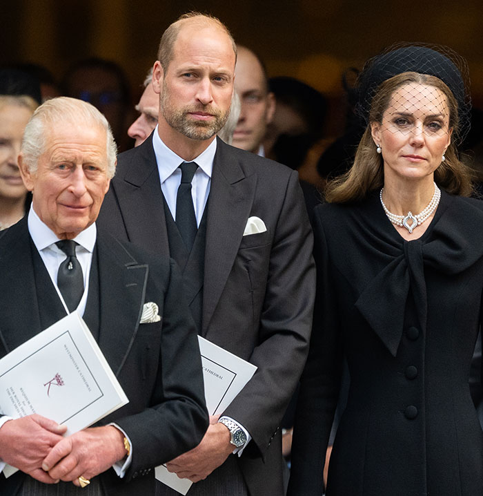 King Charles, Kate Middleton, and Prince William dressed in black attending a royal funeral ceremony. King Charles, Kate Middleton, and Prince William dressed in black attending a royal funeral ceremony.
