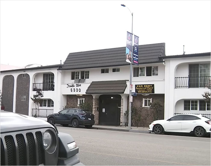 Apartment building exterior with parked cars, related to American Nightmare mom found lifeless after online marriage. Apartment building exterior with parked cars, related to American Nightmare mom found lifeless after online marriage.