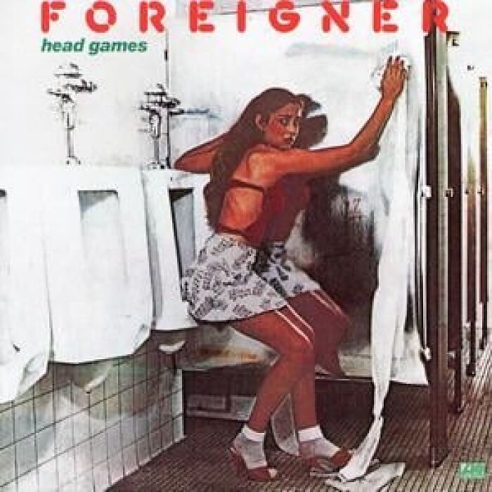 Woman crouching near urinals in a restroom on an album cover, part of worst album covers widely discussed online.