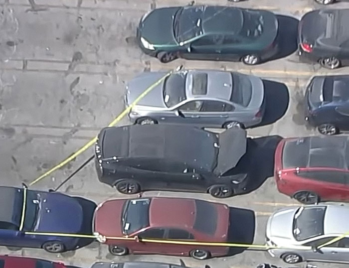 Black Tesla parked in a lot surrounded by police tape after decomposing body was found in abandoned vehicle linked to singer. Black Tesla parked in a lot surrounded by police tape after decomposing body was found in abandoned vehicle linked to singer.