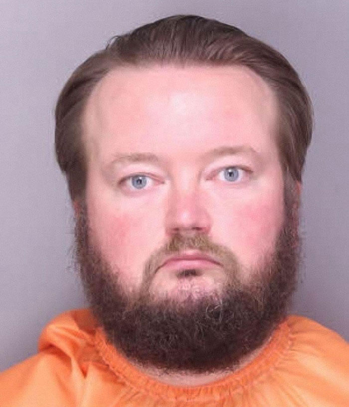 Mugshot of a teacher arrested for using poop spray around school causing sickness and costly repairs. Mugshot of a teacher arrested for using poop spray around school causing sickness and costly repairs.