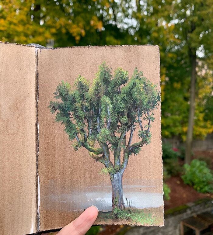 A detailed painting of a tree in a sketchbook showcasing the beauty of the natural world by Dina Brodsky.