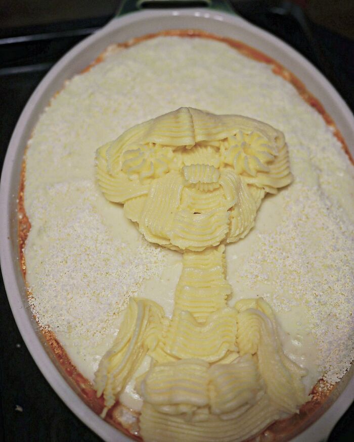 Creative meal shaped like a cartoon character in a baking dish, showcasing incredibly creative meals for kids from Japan.