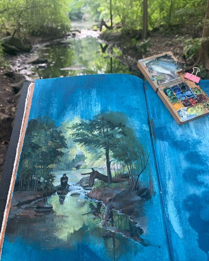 Open sketchbook displaying detailed painting of a natural forest scene by Dina Brodsky with watercolor palette nearby.