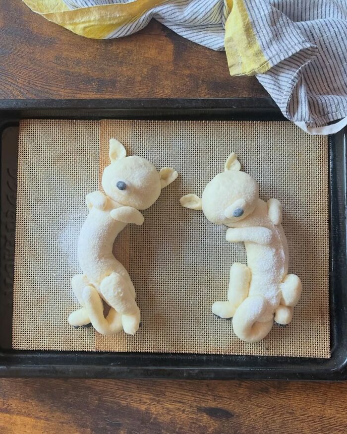 Creative meals for kids featuring adorable animal-shaped bread rolls in a basket lined with a striped cloth.