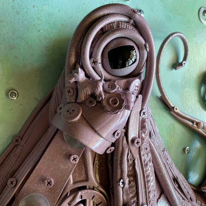 Octopus sculpture made from recycled trash and scrap materials, showcasing stunning animal sculptures created by an innovative artist.