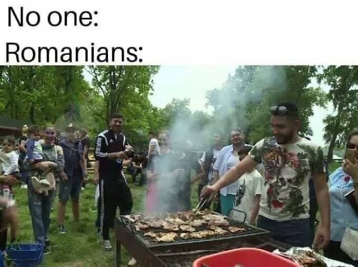 Group of people enjoying outdoor barbecue with grilled meat and smoke, a relatable scene for Eastern Europe culture memes.