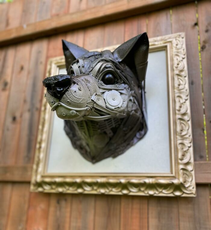 Sculpture of an animal head made from repurposed trash, showcasing stunning recycled materials and artistic creativity.