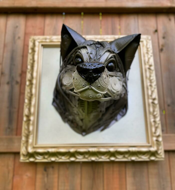 Sculpture of an animal head made from repurposed trash, showcasing stunning recycled materials and artistic creativity.