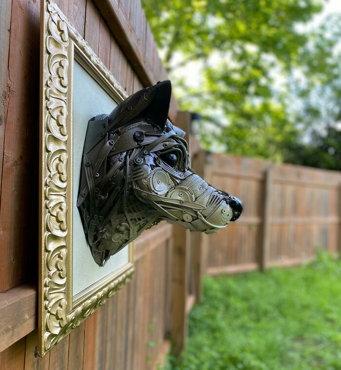 Sculpture of an animal head made from repurposed trash, showcasing stunning recycled materials and artistic creativity.