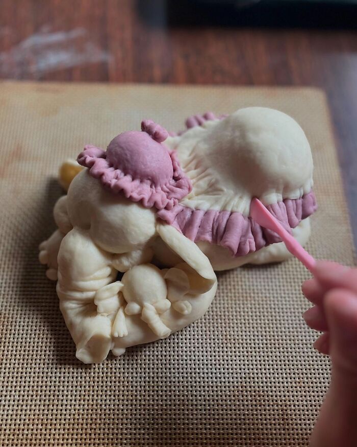 Creative meals for kids featuring elephant-shaped bread with detailed eyes and decorations on a kitchen towel, showcasing Japanese inspiration.