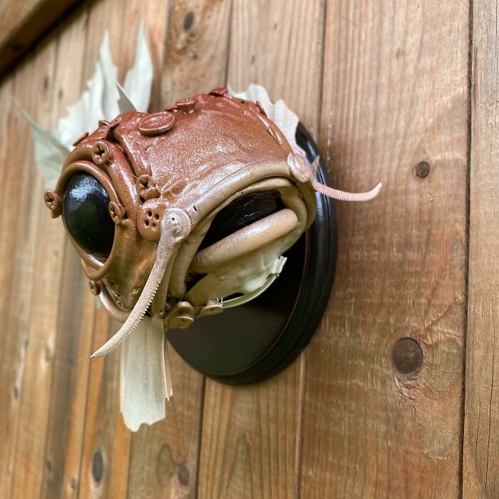 Steampunk-style fish sculpture made from recycled trash materials showcasing creative animal sculptures by an innovative artist.