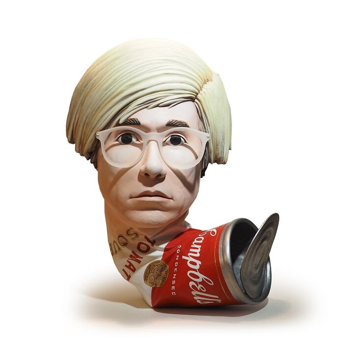 Sculpture blending a human head with a crushed Campbell’s tomato soup can, showcasing waste turned into witty art commentary.
