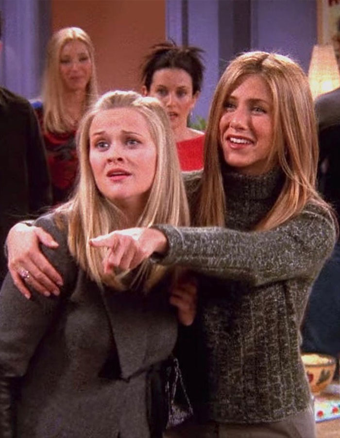 Jennifer Aniston and Reese Witherspoon together in a candid moment from a popular TV show episode. Jennifer Aniston and Reese Witherspoon together in a candid moment from a popular TV show episode.