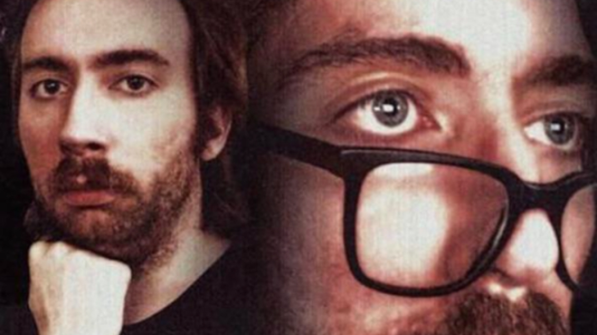 Close-up of a man with glasses and beard, featuring a thoughtful expression for Tinder bios for guys.