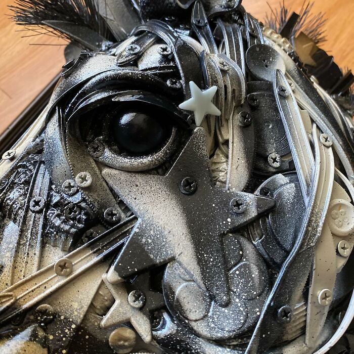 Horse sculpture made from recycled trash and metal parts, showcasing stunning animal sculptures in a framed wall art piece.