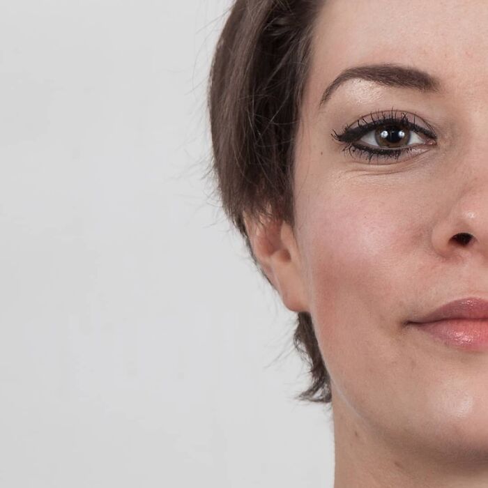 Young woman with expressive eyes and natural look, illustrating family DNA resemblance in genetic portraits concept.