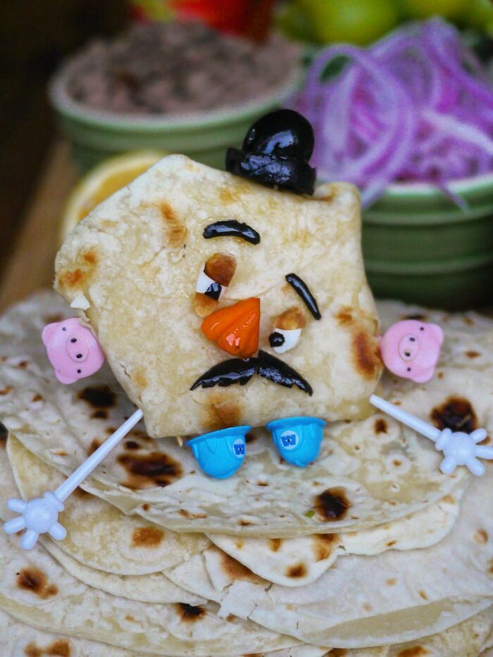 Creative meal by a mom from Japan featuring a character made with flatbread and colorful edible decorations for kids.