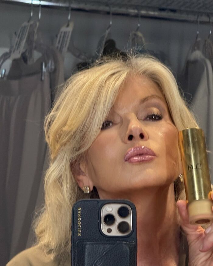 Martha Stewart taking a close-up selfie holding a gold cosmetic bottle, sparking plastic surgery rumors. Martha Stewart taking a close-up selfie holding a gold cosmetic bottle, sparking plastic surgery rumors.