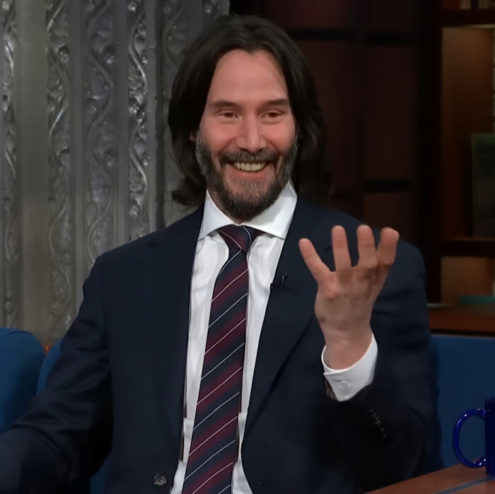 Keanu Reeves smiling in a suit during a TV interview discussing marriage rumors and relationship news. Keanu Reeves smiling in a suit during a TV interview discussing marriage rumors and relationship news.