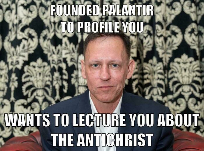 Man with serious expression in front of patterned background, representing chaotic good doing the right thing in their own way.