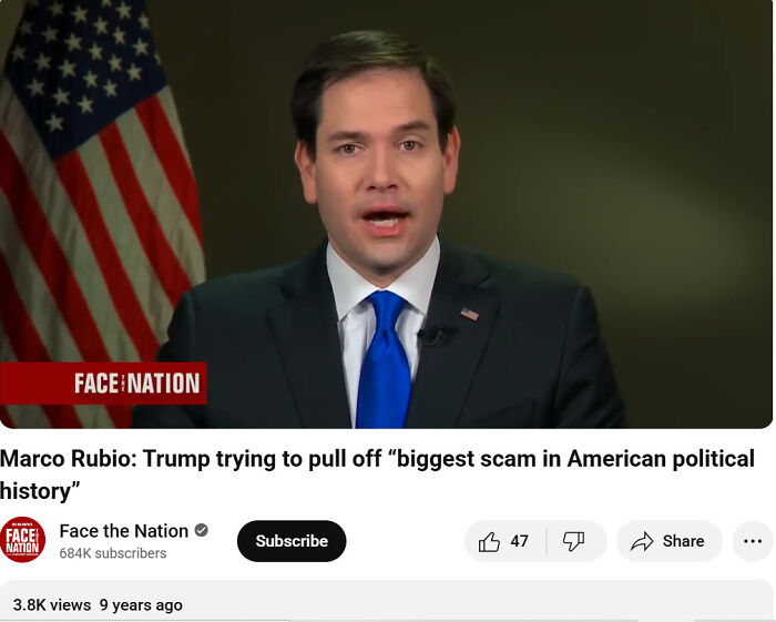 aged like wine posts: male politician in dark suit and blue tie speaking in a TV interview with US flag