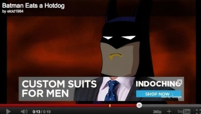 Batman animated character with a custom suits for men ad overlay showing an advertising placement fail example.