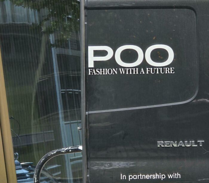 Black van with an advertising placement fail showing the word P*O instead of a fashion brand name.