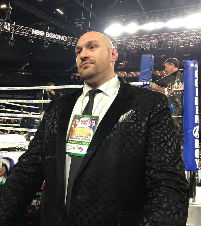 Professional boxer Tyson Fury wearing a black suit inside a boxing ring at an HBO Boxing event, highest paid athletes 2025.