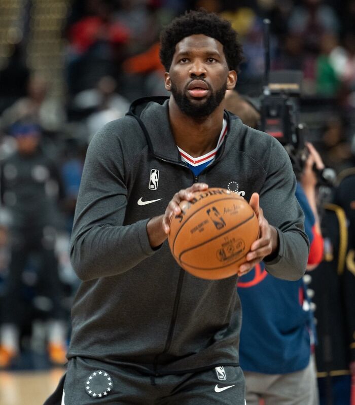 Professional athlete warming up with a basketball during a game, representing highest paid athletes 2025.